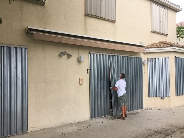 Accordion hurricane shutters