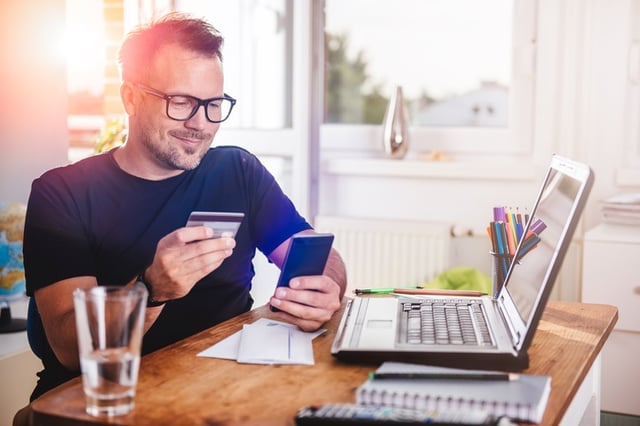 Businessman using mobile and online banking