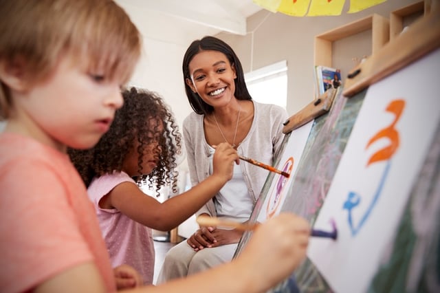 Kids using art supplies bought by teacher