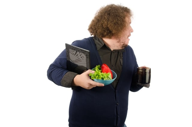 Man with coffee and salad in hands.jpg