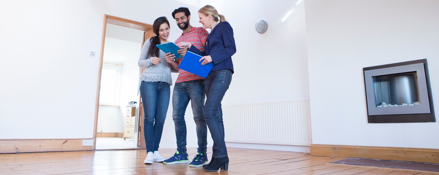 Image - couple with realtor in new house