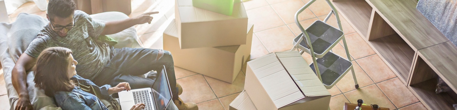 Image- couple sitting in new house