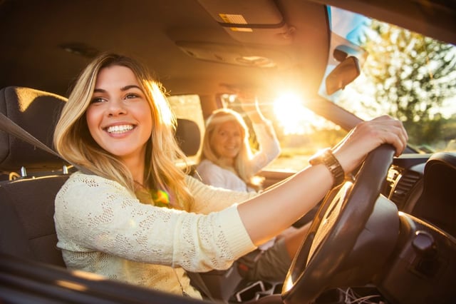 Mother and daughter in new car