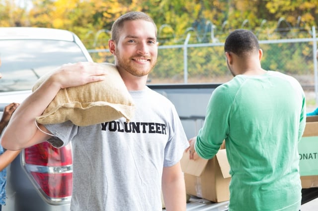 Volunteer unloading donated food from truck.jpg