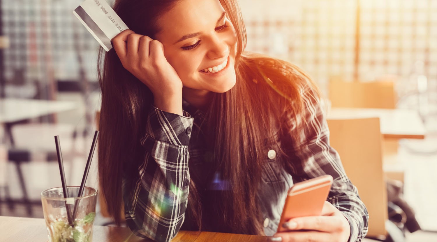 Image of young lady using TFCU CardValet Image of young lady using TFCU CardValet
