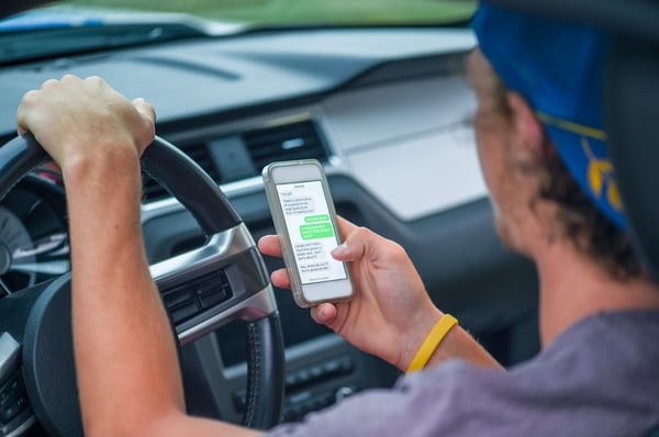 college student texting and driving