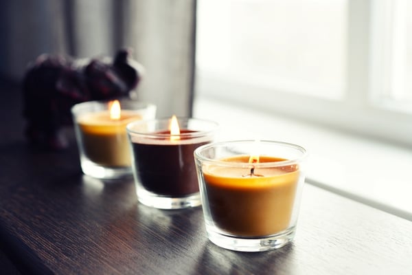 cozy candles on wooden end table