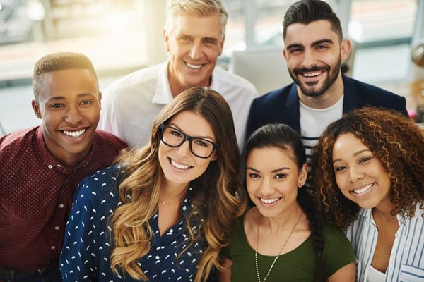 diverse group of people smiling for groupshot