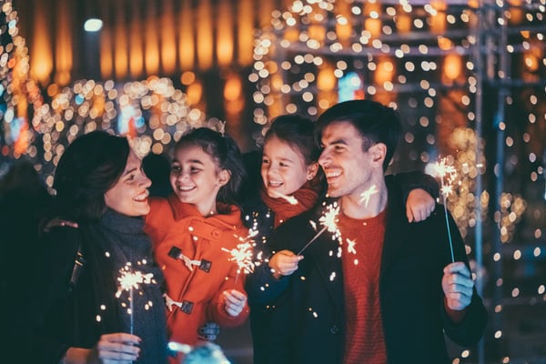 family enjoying holiday light show together