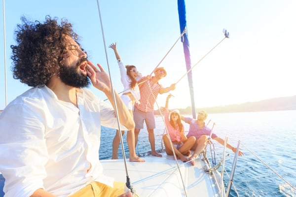 friends take selfie while boating