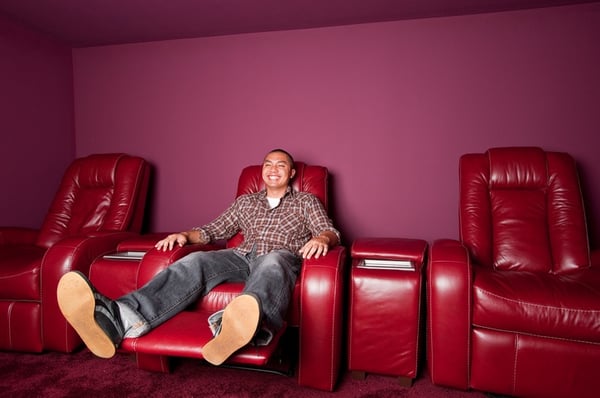 man enojying his time on recliner chair in man cave