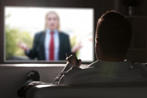 man watching big screen tv