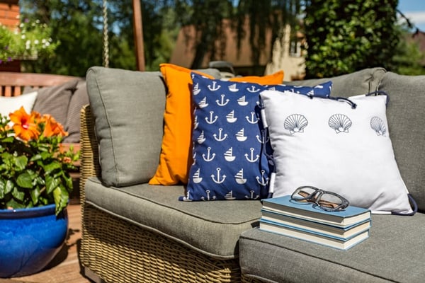 patterned pillows on outdoor furniture