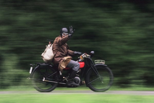 vintage motorcyclist wave