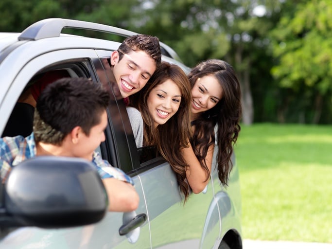 college friends in car