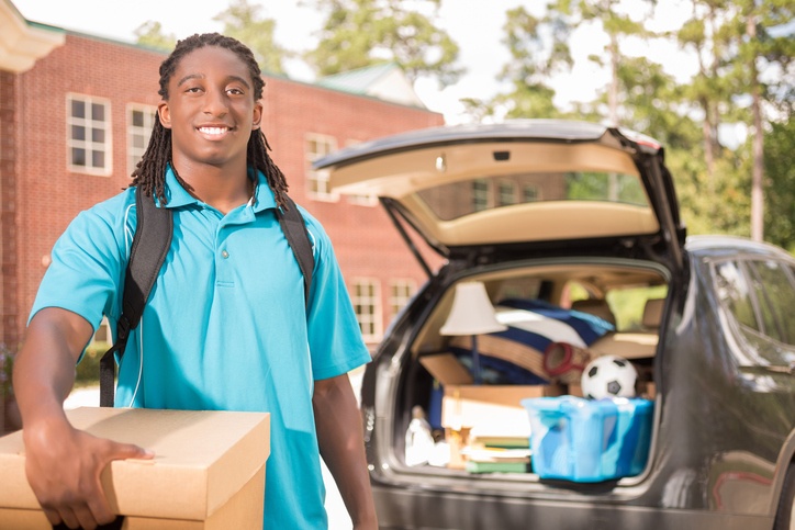 college student unpacking car into dorms